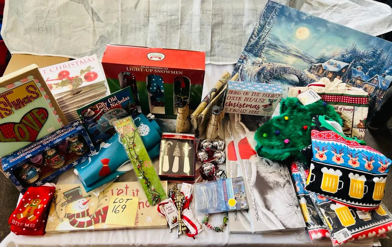 Lot 169- Large Lot Christmas New, 4 Christmas ugly sweaters, Artwork, Banners, outside 7 foot banners, 2 sets of Christmas Kitten cards, 17 Christmas CD sets, snowmen, solar stake, believe bells etc, 56 Pieces