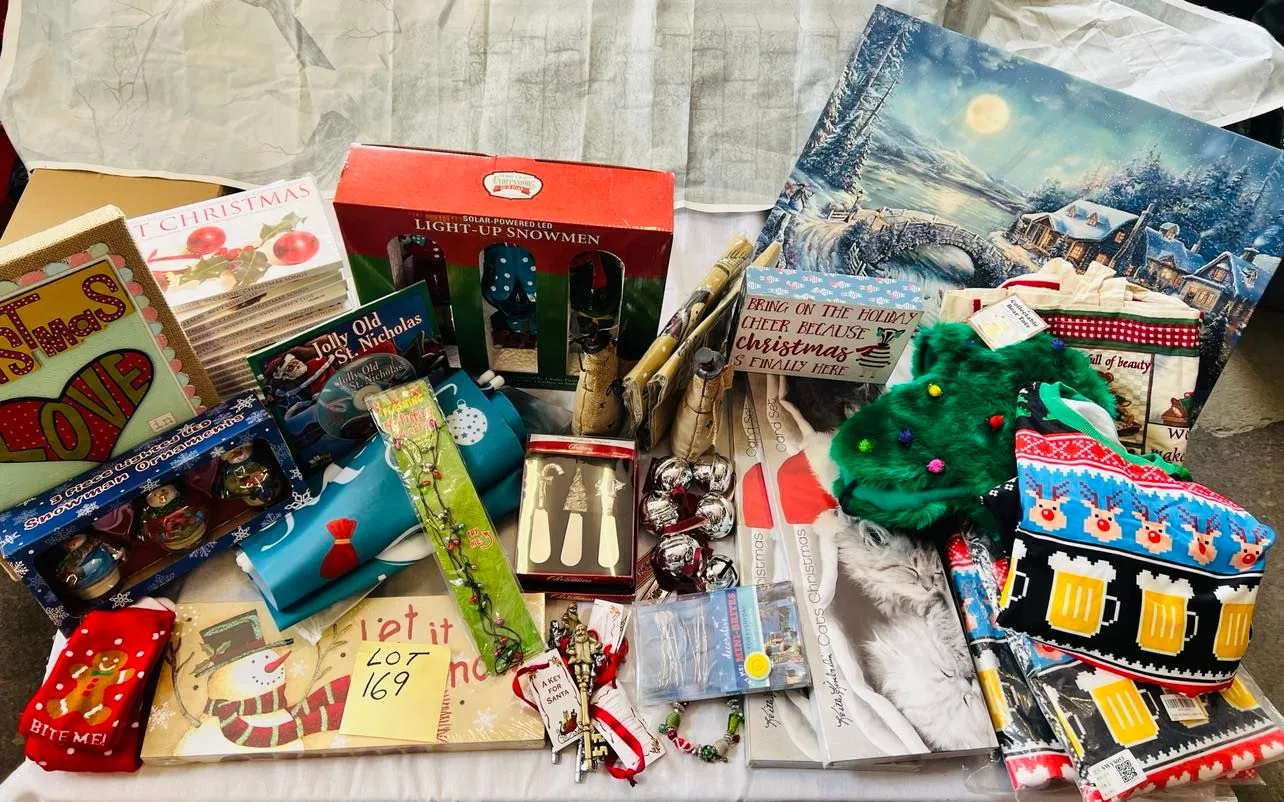 Lot 169- Large Lot Christmas New, 4 Christmas ugly sweaters, Artwork, Banners, outside 7 foot banners, 2 sets of Christmas Kitten cards, 17 Christmas CD sets, snowmen, solar stake, believe bells etc, 56 Pieces